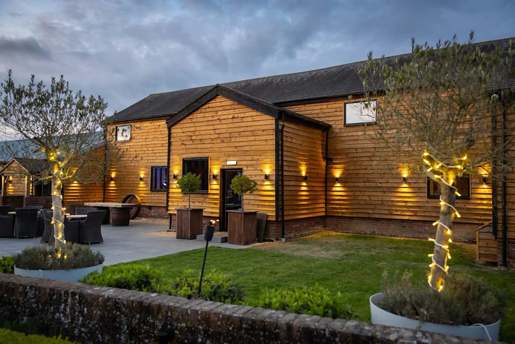 Milling Barn wedding DJ setup with elegant lighting and packed dancefloor in Buntingford, Hertfordshire