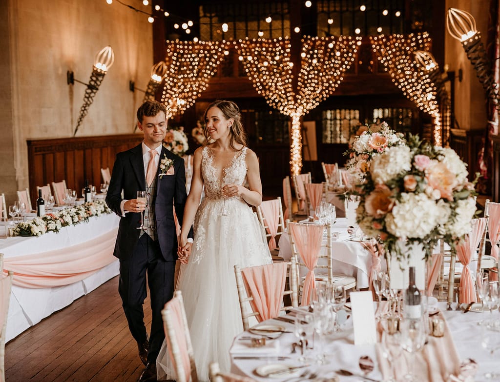 Fanhams Hall wedding reception with DJ setup, ambient lighting and guests dancing in Ware Hertfordshire