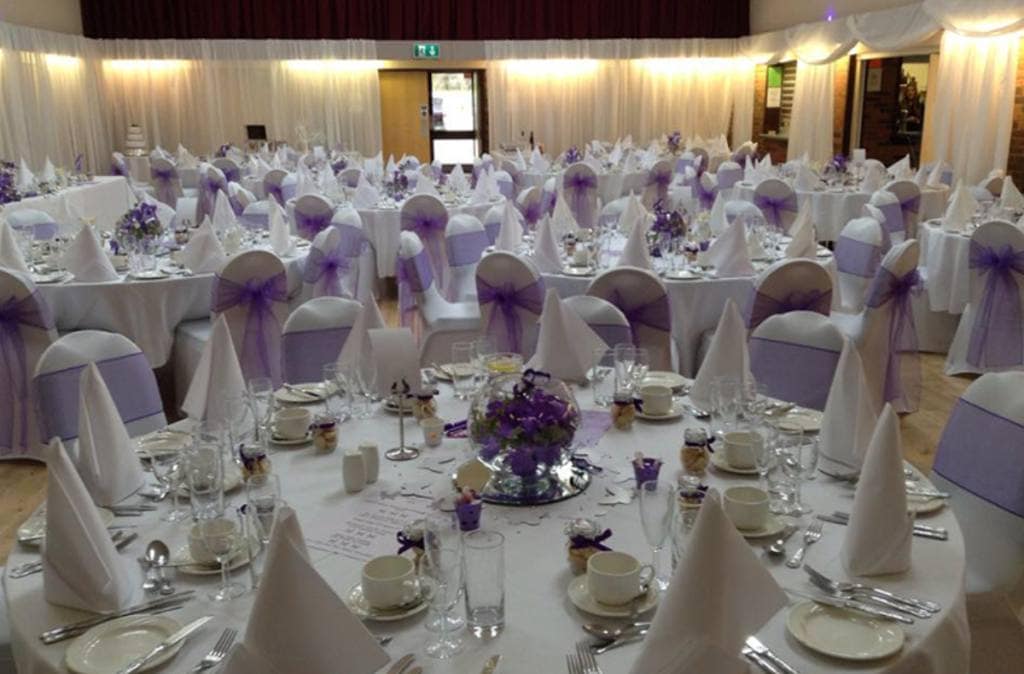 Professional wedding DJ setup at stylish weekday UK reception with lighting