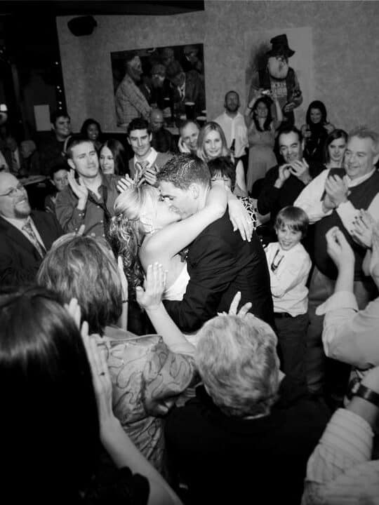Bride and groom first dance at Tewin Bury Farm with romantic DJ lighting setup
