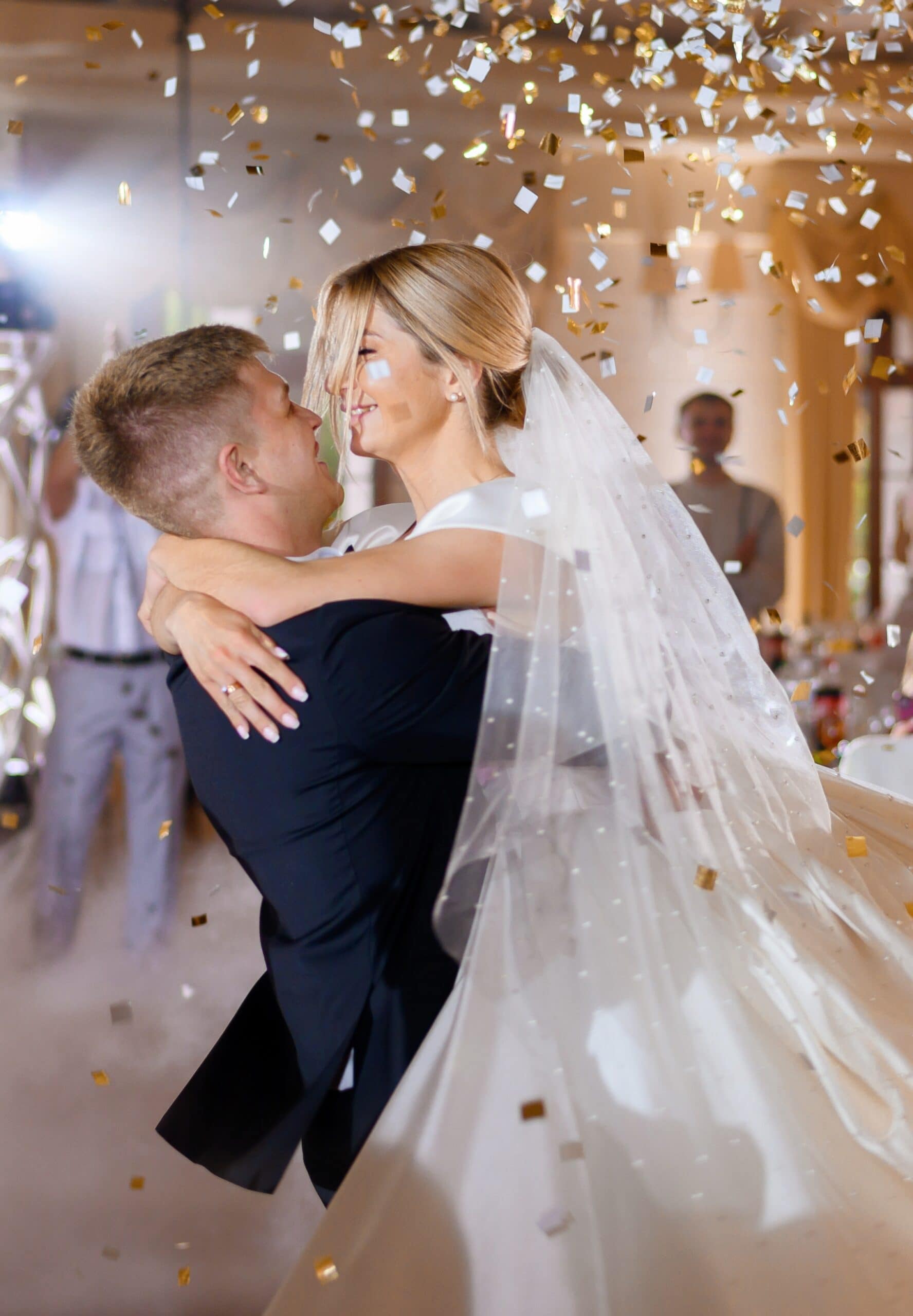 Wedding DJ Hire with groom holding bridge during 1st dance wedding song