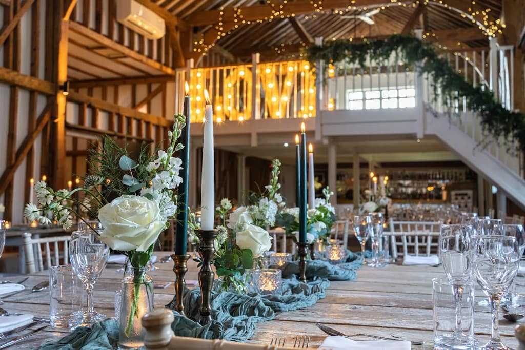 Bride and groom dancing at Milling Barn wedding with customised DJ playlist and ambient lighting
