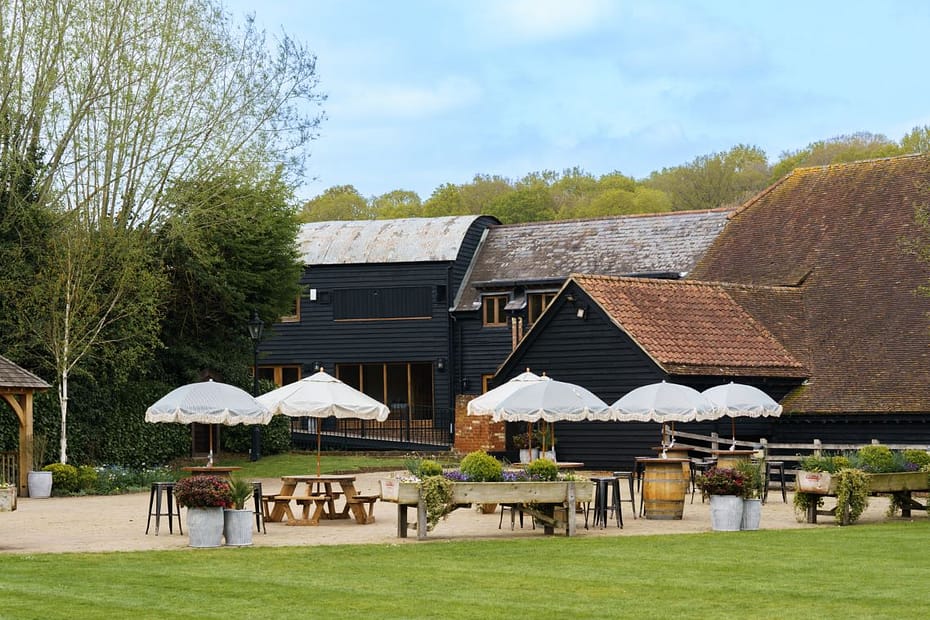 Tewin Bury Farm wedding DJ setup with elegant lighting and packed dancefloor in Hertfordshire